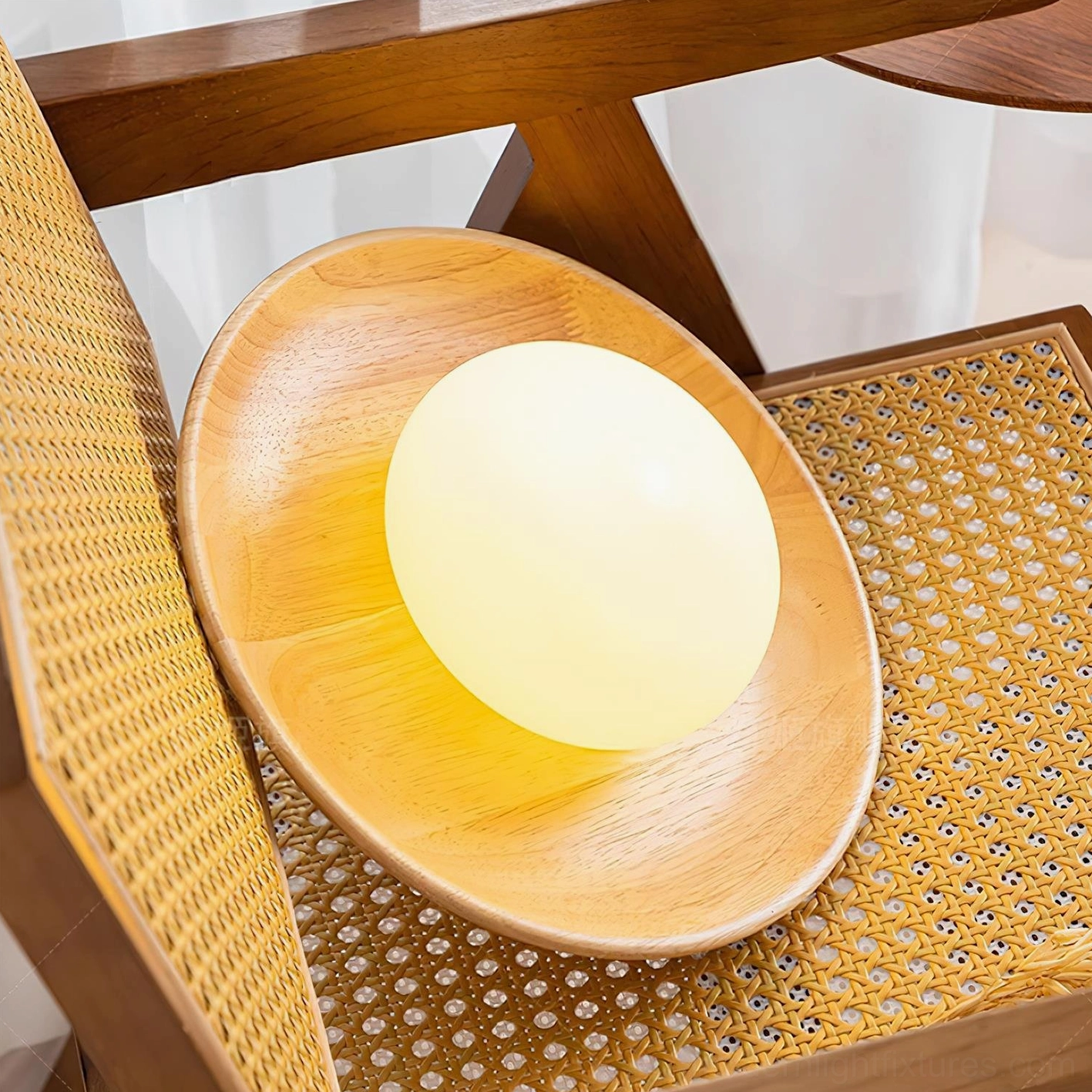 Frosted glass sphere shade detail showing light diffusion in round wall sconce