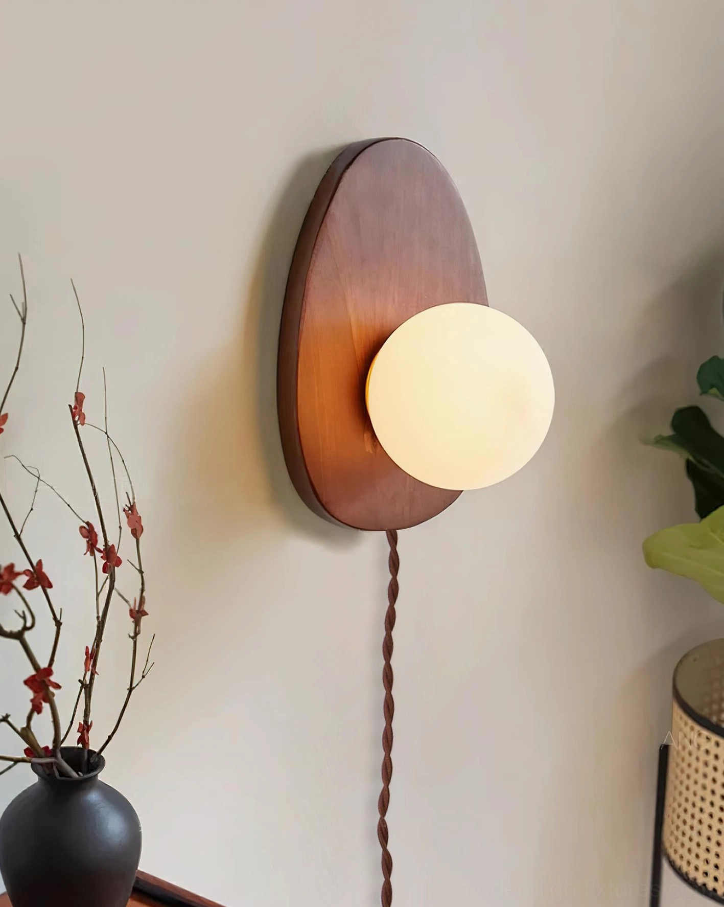Frosted glass wall sconce pair creating symmetrical bedroom lighting above nightstands, warm ambiance