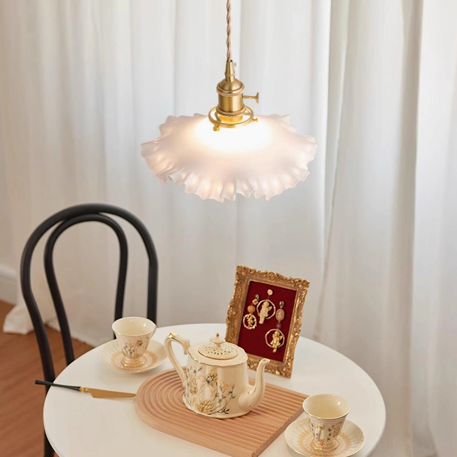 Frosted ruffled glass pendant light, artistic product photography highlighting sculptural texture
