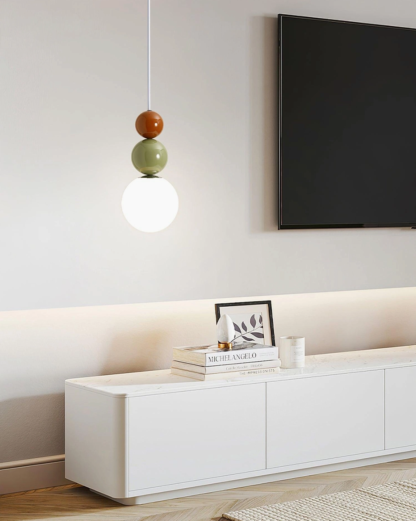 Three-sphere pendant lamp with frosted white glass spheres and metal frame construction