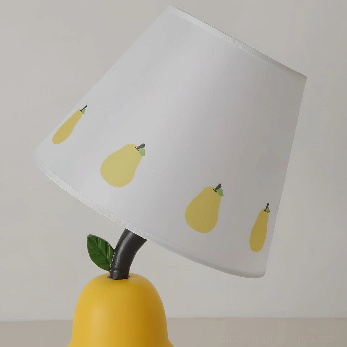 Fruit-shaped table lamp design collection showing apple and pear models with color variations