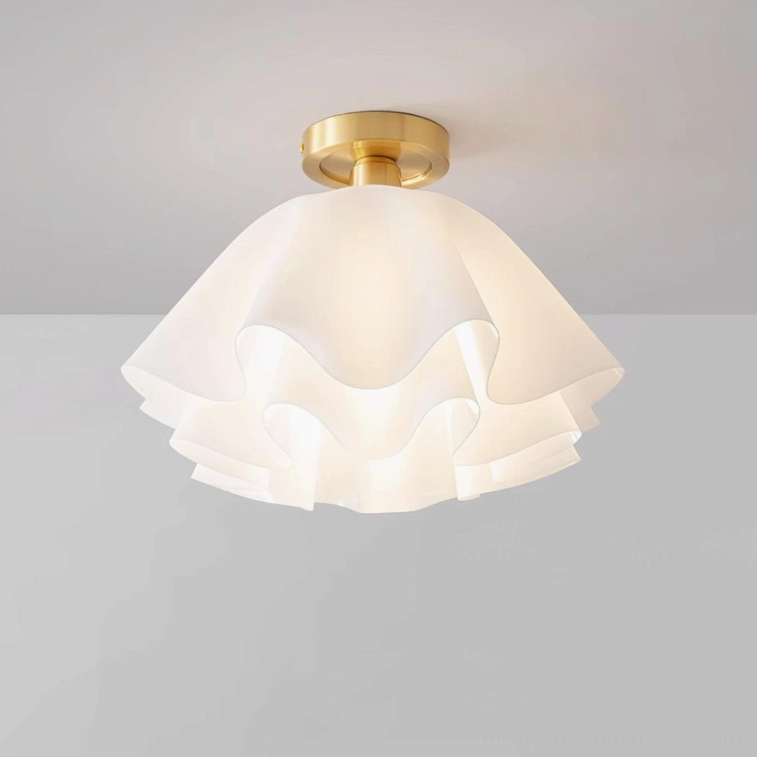 Gailon pleated brass ceiling light front close-up showing layered frosted ruffled acrylic shade and brass metal base