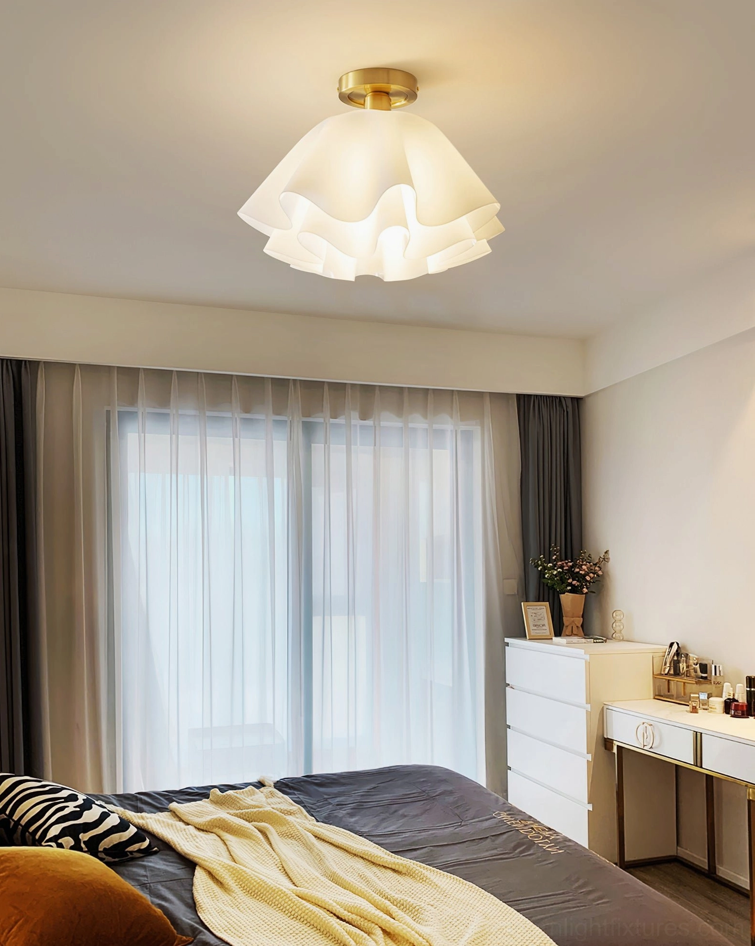 Gailon pleated ceiling light fixture installed in residential dining room with modern furnishings