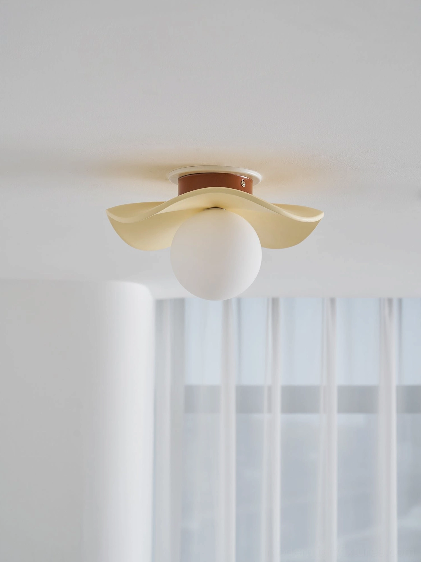 Gand ceiling light fixture in bedroom showing soft diffused illumination and warm ambiance