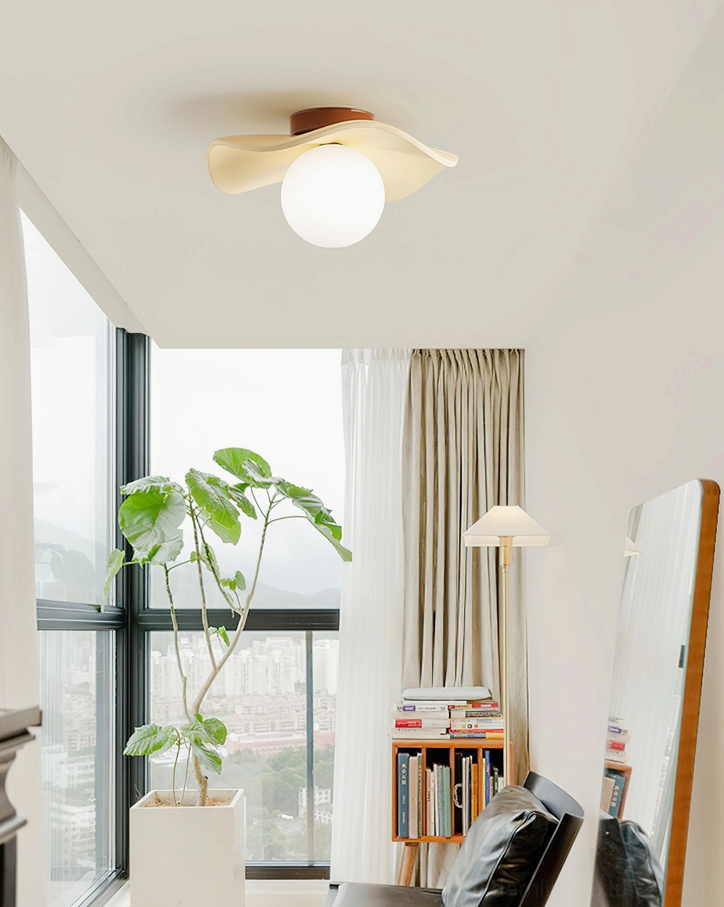 Gand flush mount ceiling light in cream beige color in bright living room with windows