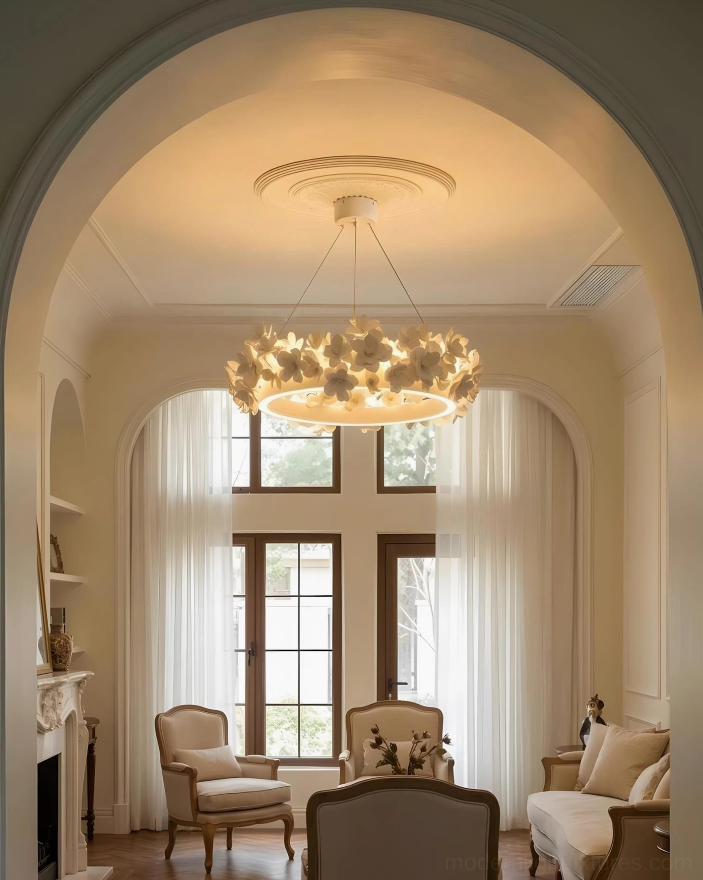 Integrated LED ring light of Gardenia Loop Chandelier creating soft diffused glow in elegant residential setting
