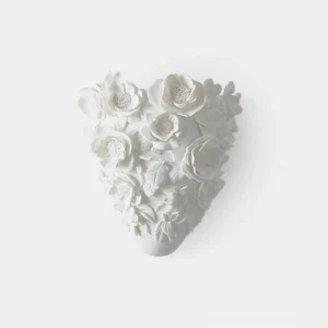 Gardenia porcelain wall sconce with sculptural floral relief, front view on white background