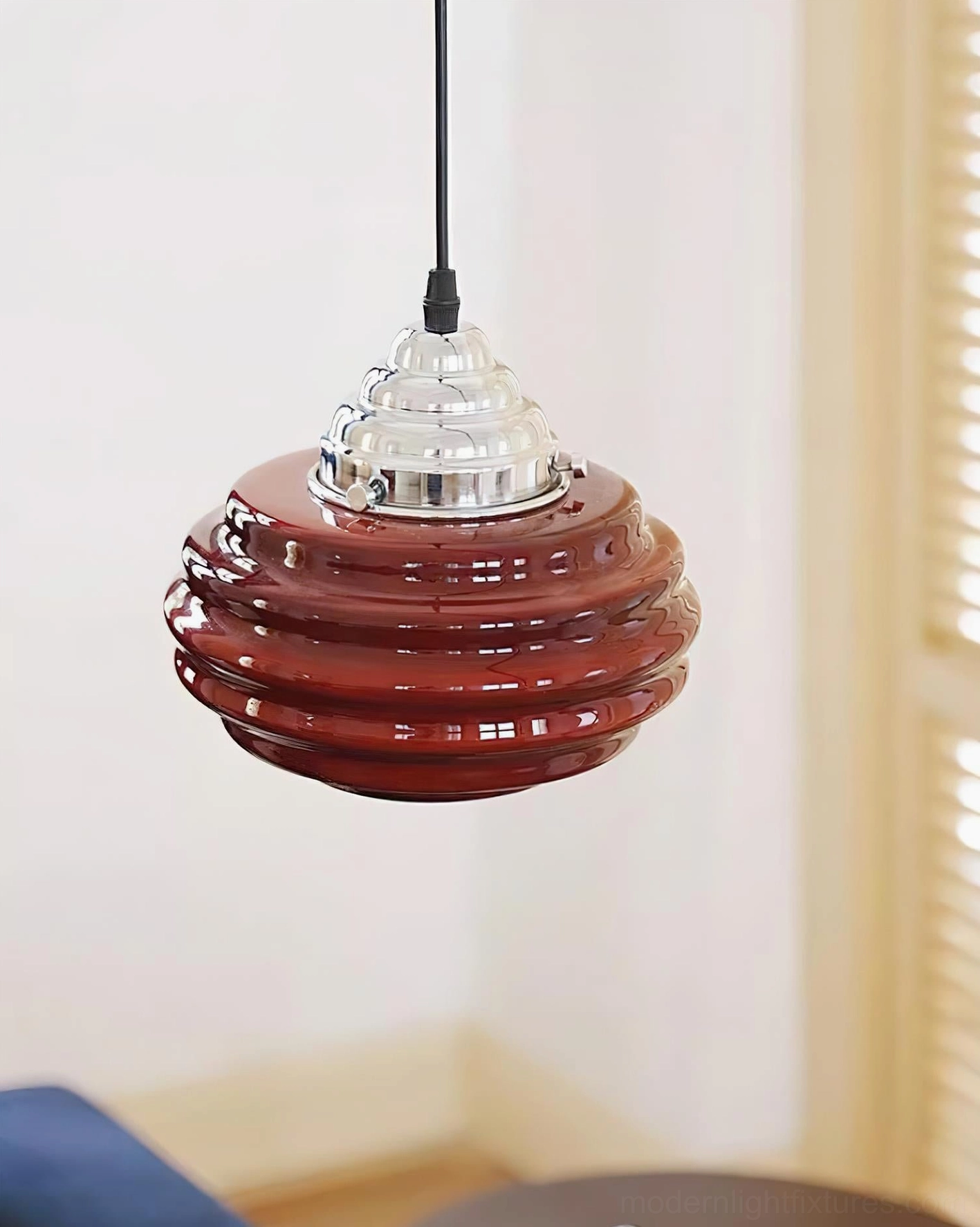 Red gelato pendant light with dark reddish-brown ribbed glass shade, front low-angle shot in room with louvered window shutters