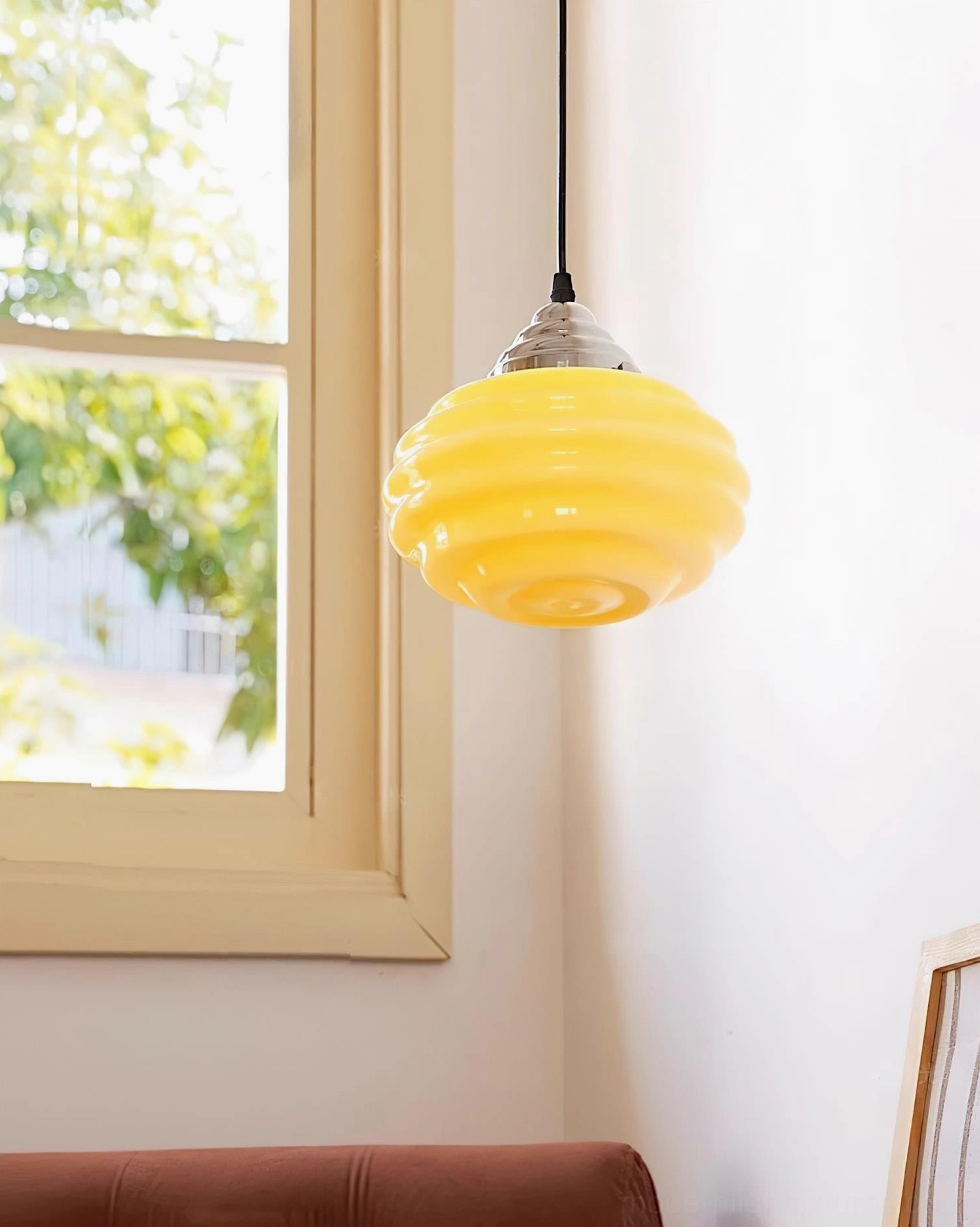 Yellow gelato pendant light overhead angle view in room corner, showing chrome ceiling mount and compact ribbed shade size