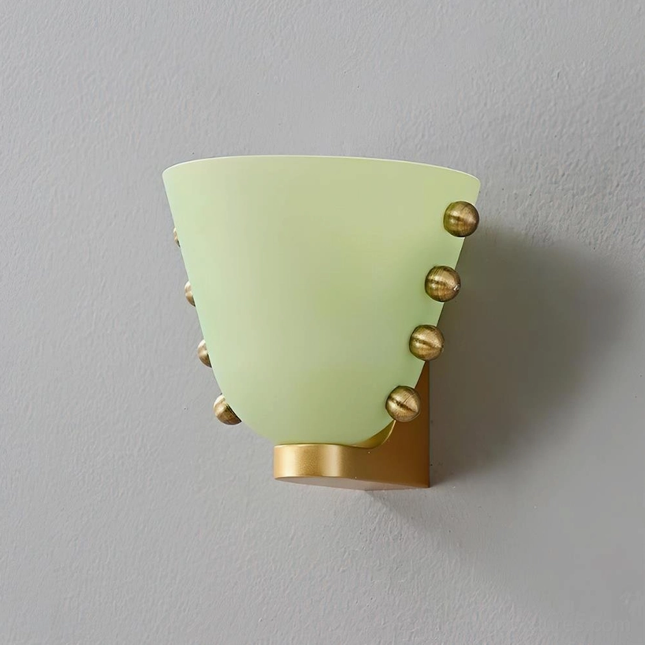 Gemma wall sconce in green frosted glass with matte brass base and decorative metal accents