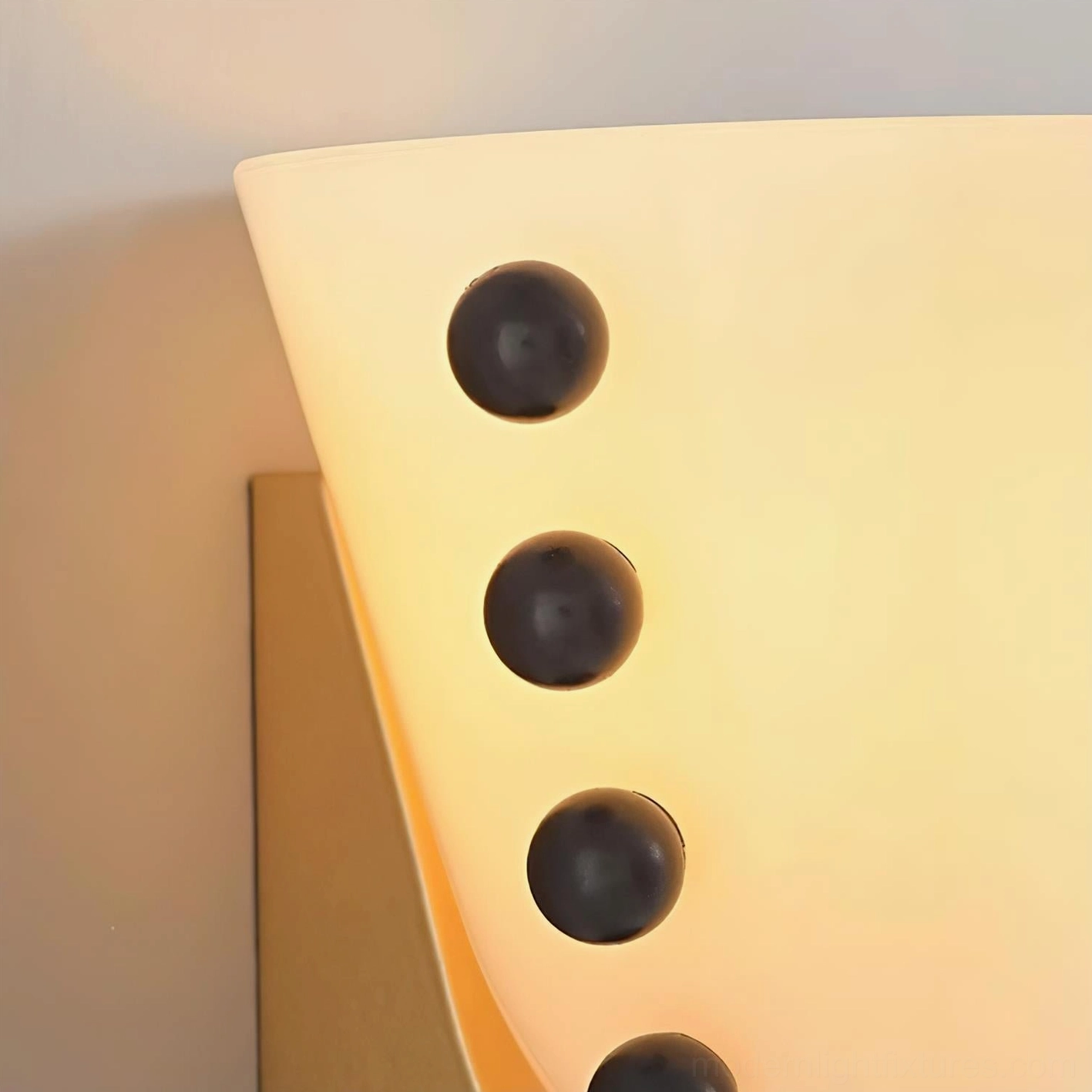 Gemma sculptural wall sconce paired with contemporary art and modern interior décor