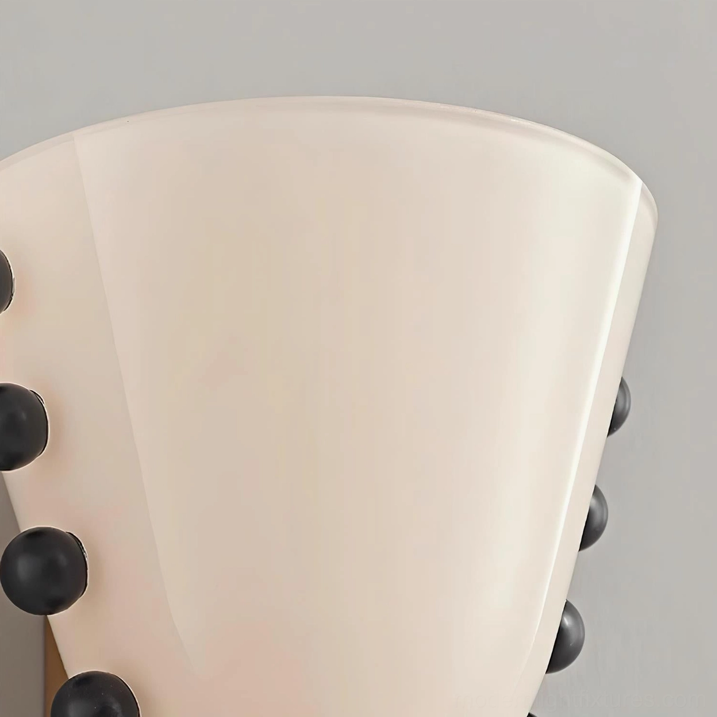 Gemma frosted glass wall sconce as statement lighting fixture in upscale modern interior design