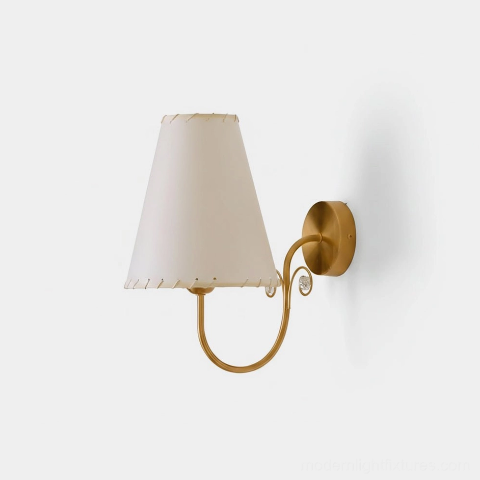 Gentle Bend wall sconce front view with brass gold curved arm and off-white fabric shade, product photography