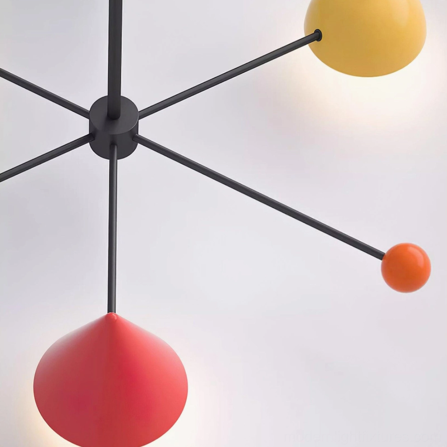 Modern geometric ceiling light fixture detail showing spherical and conical lamp head design elements