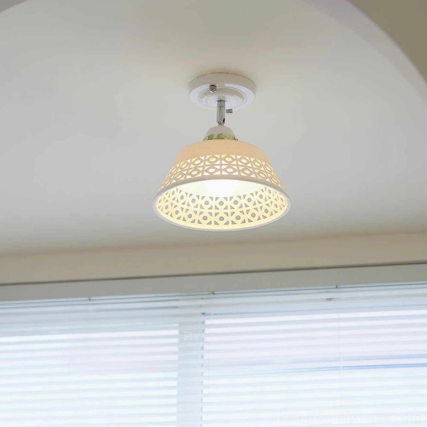 Geometric cutout ceiling light fixture overhead view with warm ambient illumination and shadow patterns