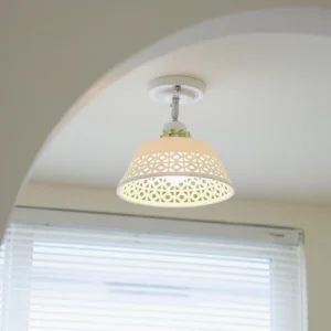Contemporary geometric hollow ceiling light fixture with white finish installed in residential room