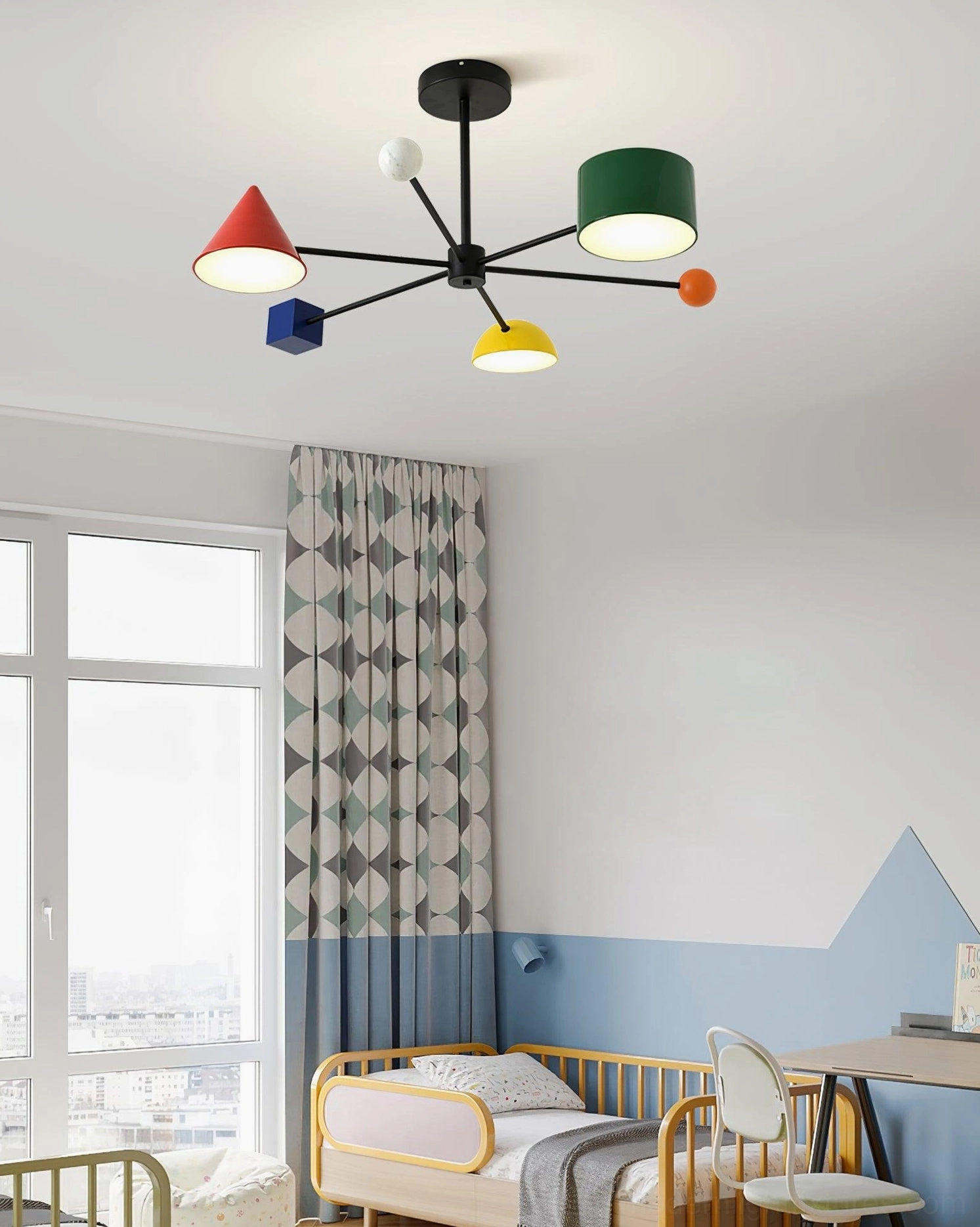 Cute Nordic geometric ceiling chandelier with colorful acrylic lamp heads in cozy kids bedroom with blue accent