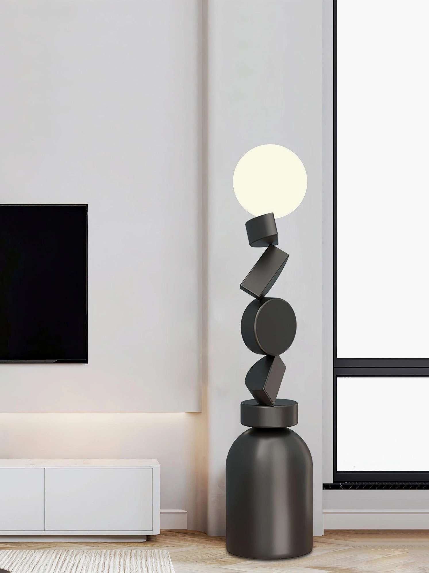 Modern geometric floor lamp in minimalist living room with white cabinet matte black finish
