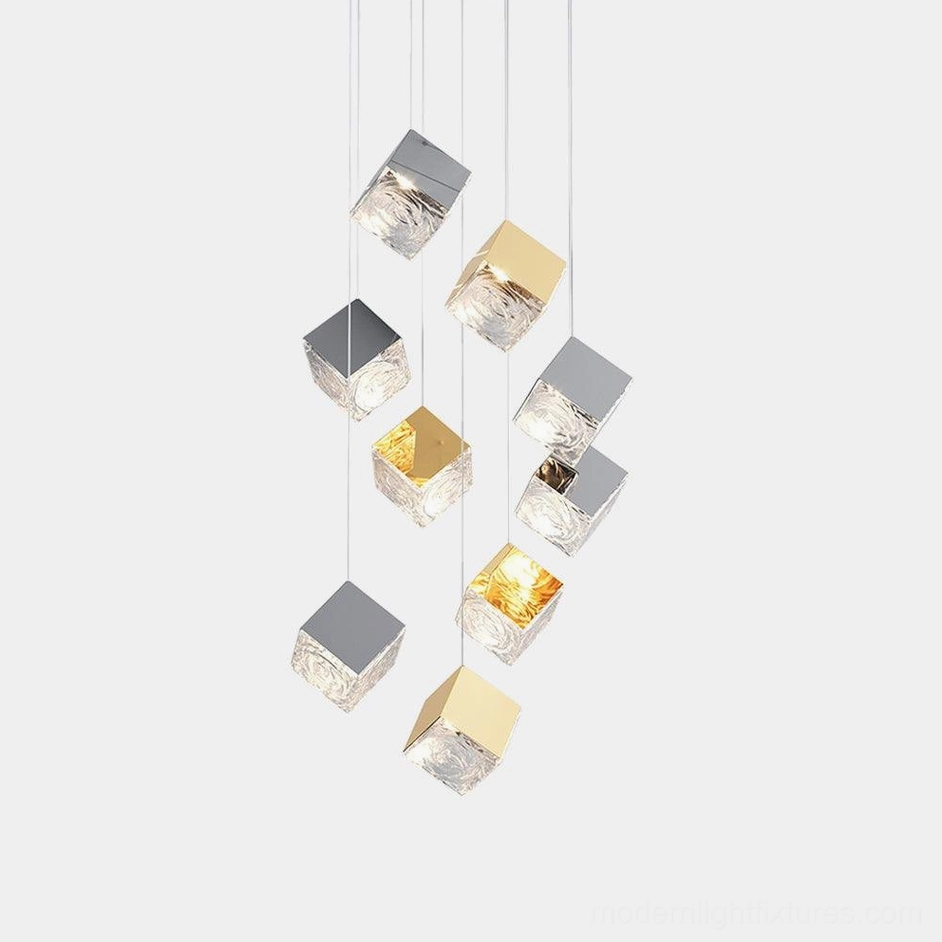 Modern geometric glass cube chandelier with gold and chrome metal frame, front view on white background