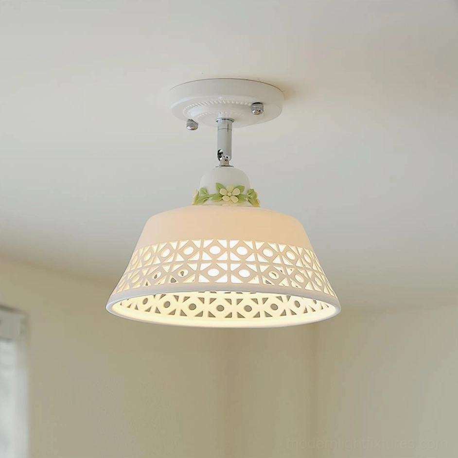 Modern ceiling light fixture with geometric hollow carved patterns and white metal shade