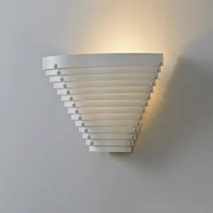 Contemporary cone-shaped wall lamp with radiating metal slats casting geometric light patterns on interior wall