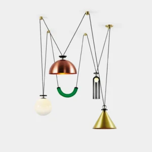 Assorted geometric modern pendant chandeliers with mixed metal finishes in white studio setting