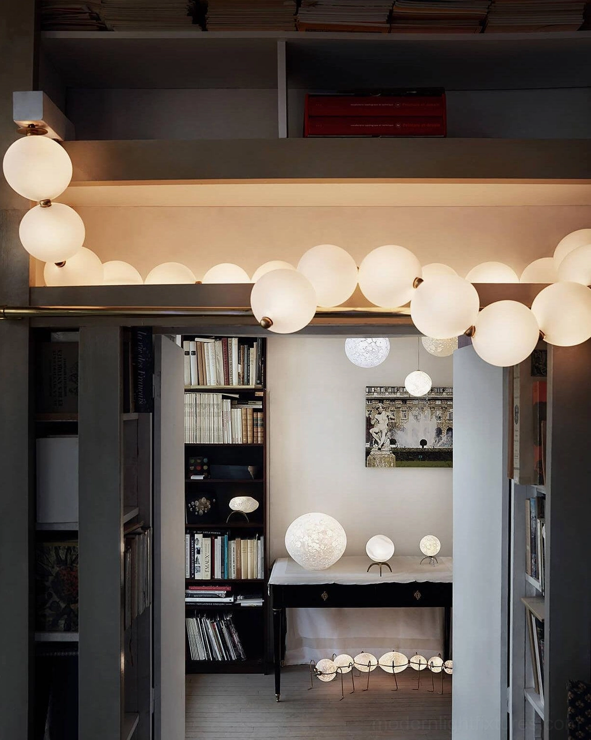 Modern pearl string chandelier featuring geometric sphere arrangement and premium material construction
