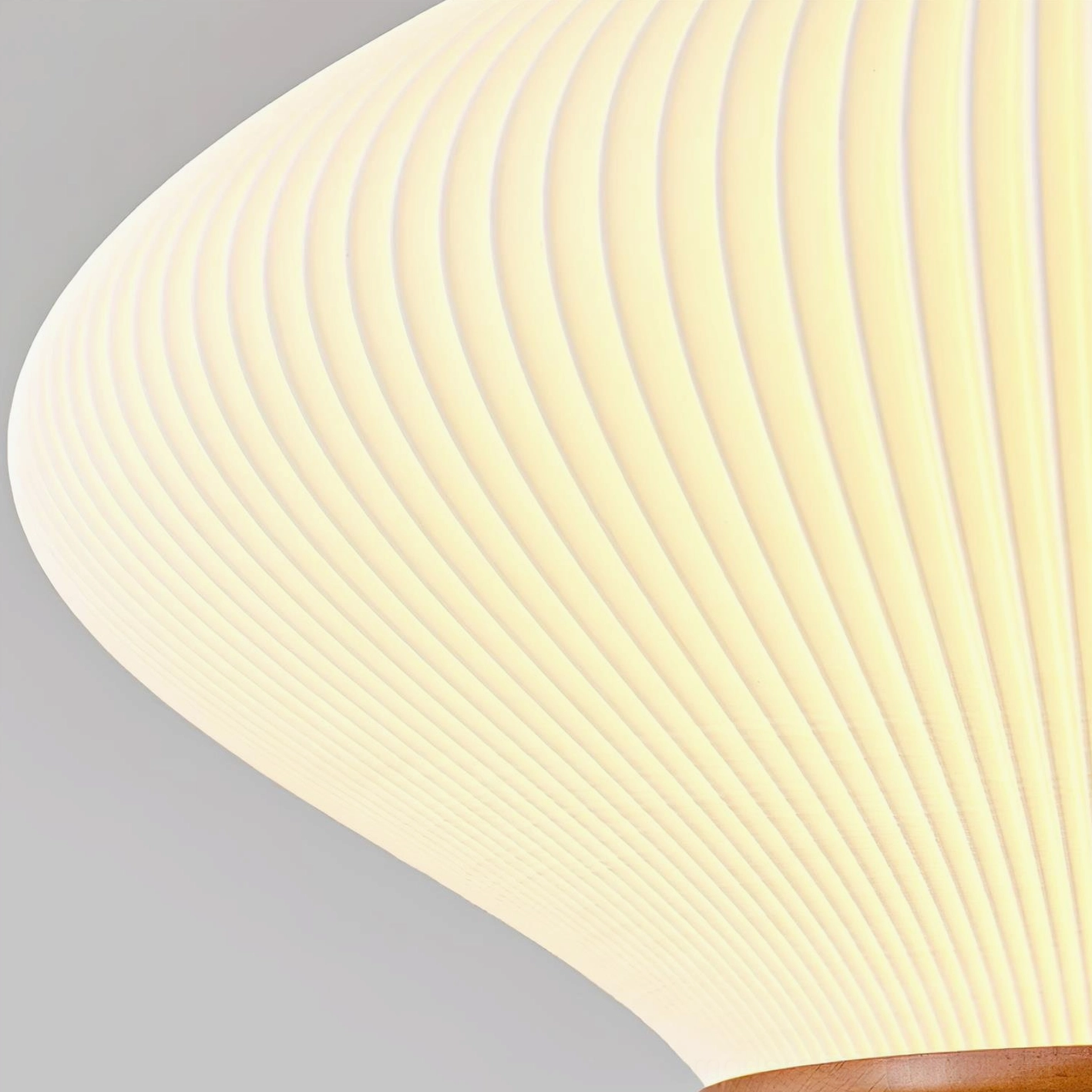 Modern minimalist pendant lamp with clean geometric biconical form, artistic studio lighting