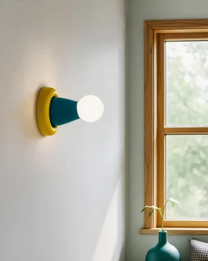 Contemporary wall sconce with color-blocking mounted on wooden feature wall, side perspective