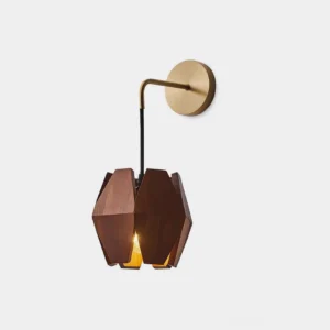 Geometric wood wall sconce with brass mount and warm interior glow - front close-up view