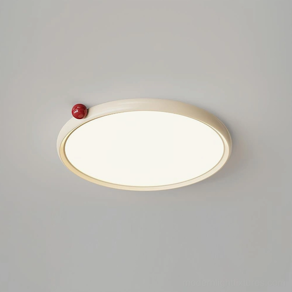 Geos LED ceiling light in beige finish installed as flush mount fixture in modern bedroom