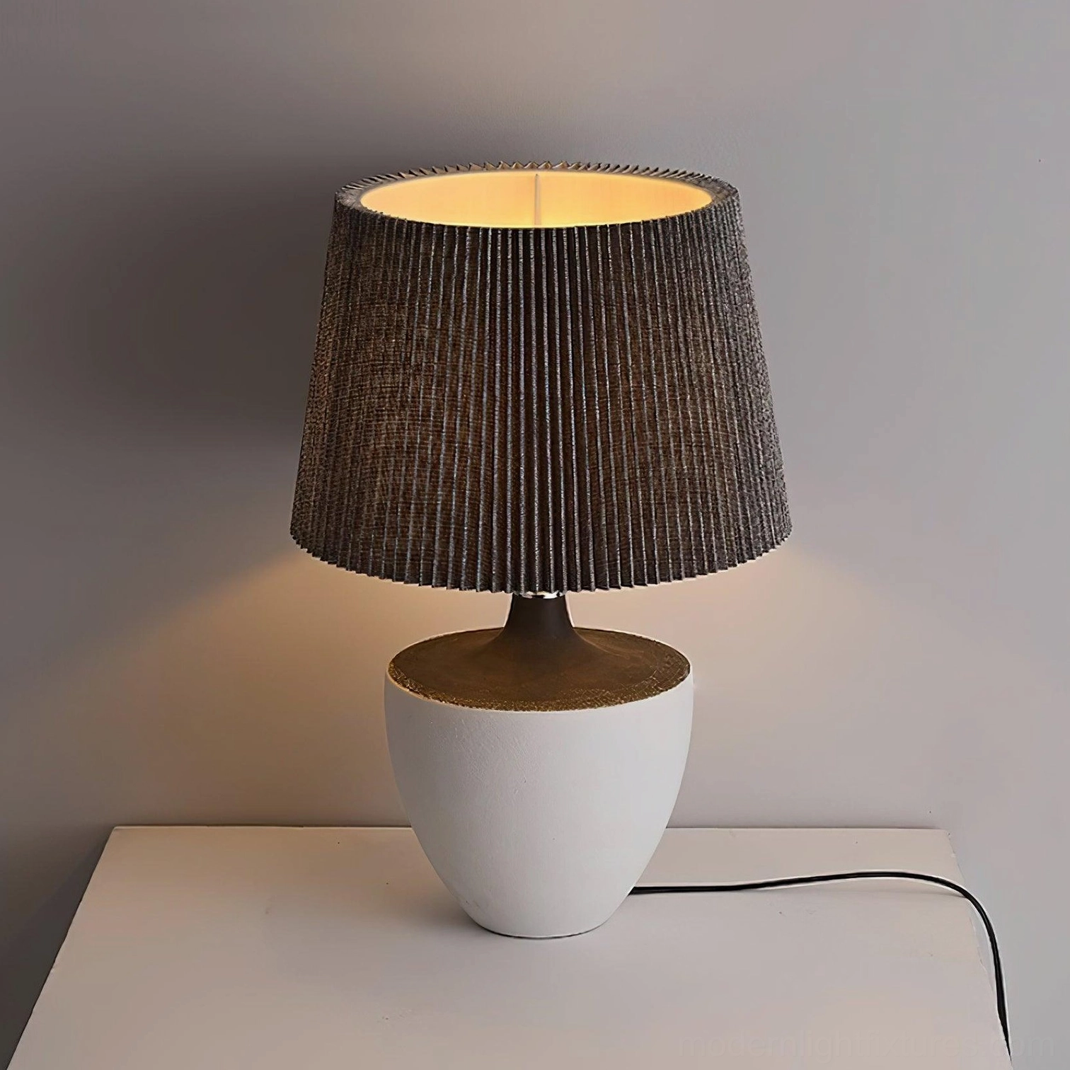 Ghassan ceramic table lamp in home interior setting demonstrating functional and decorative lighting solution