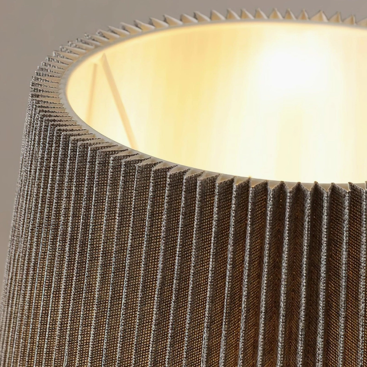 Ghassan ceramic table lamp soft lighting effect through pleated shade creating warm comfortable ambiance