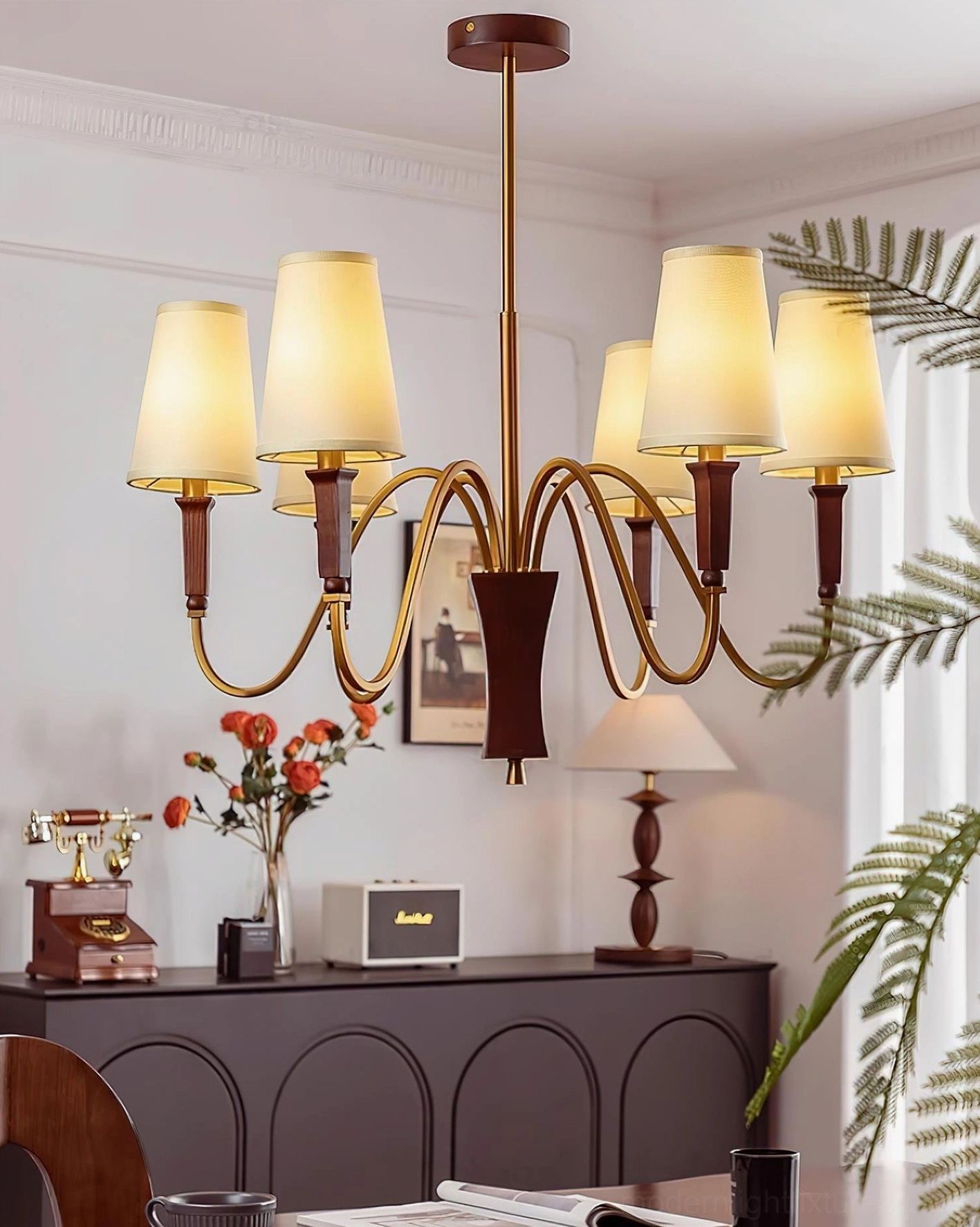 Gianna 8-light chandelier in vintage American dining room with tapered fabric shades and brass metal construction