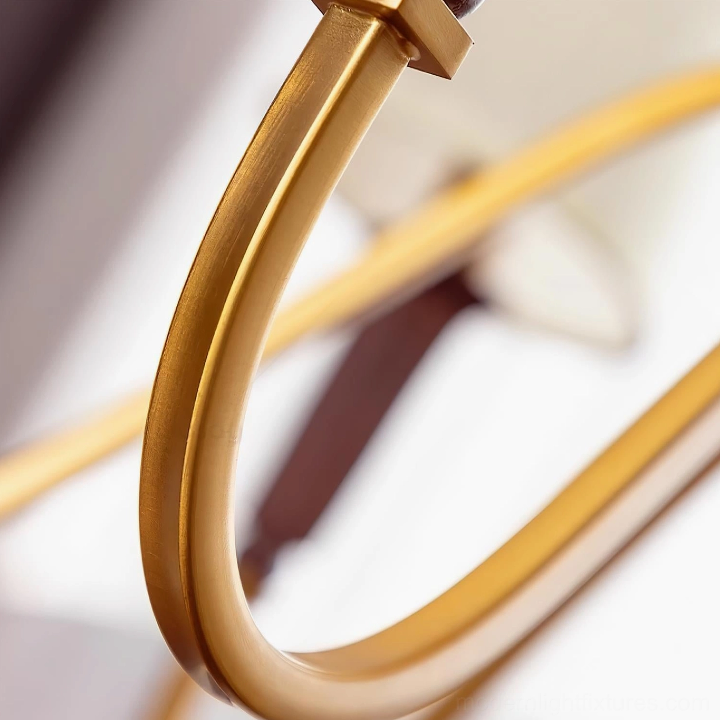 Gianna chandelier detailed view of metal arm structure and shade mounting in elegant gallery-like interior