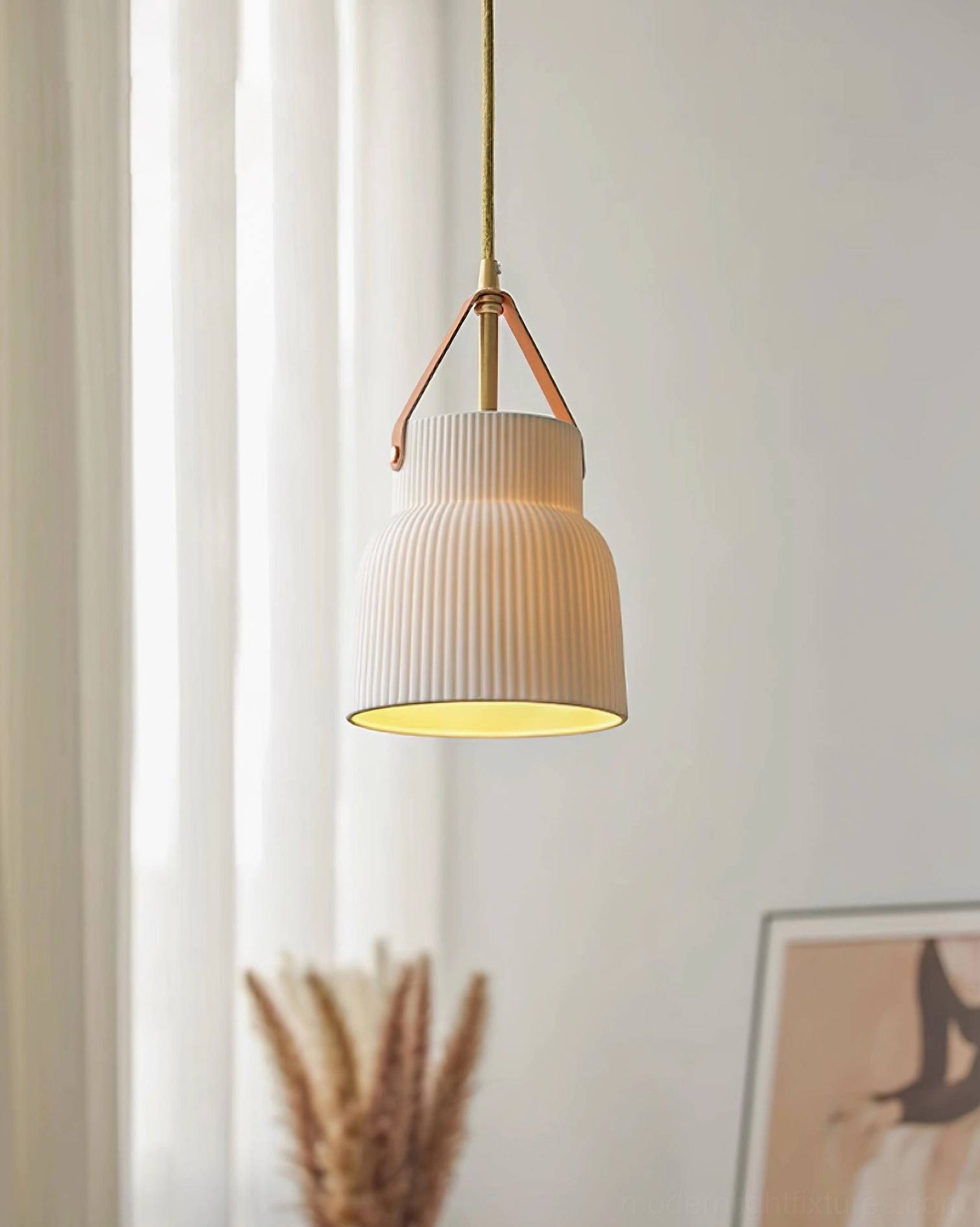 Ceramic ribbed pendant light side profile showing bell-shaped textured shade in cozy home setting with dried florals