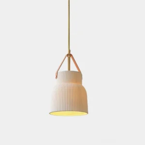 Gina ridged ceramic pendant light front view studio shot showing textured white shade with brass top and tan leather suspension strap