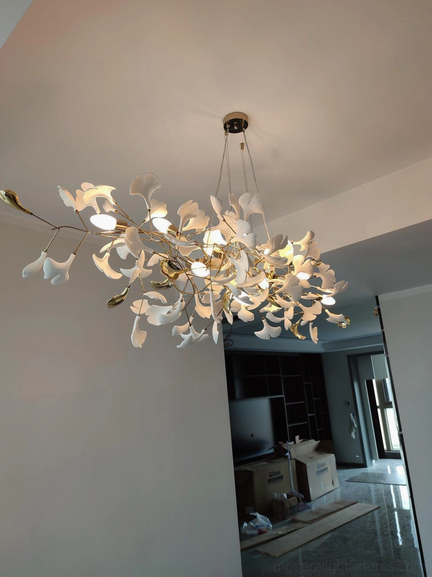 Ginkgo leaf chandelier branches - close-up showing flexible metal framework and ceramic leaf arrangement