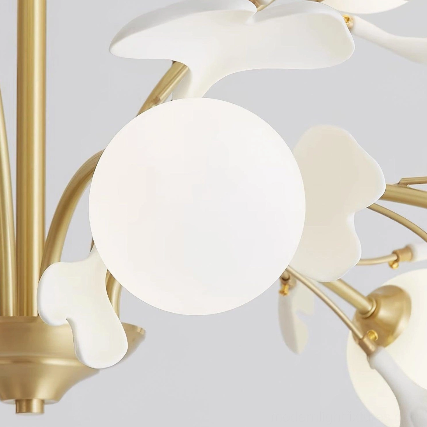 Ginkgo chandelier brass frame patina and finish detail, showing warm gold color and material quality
