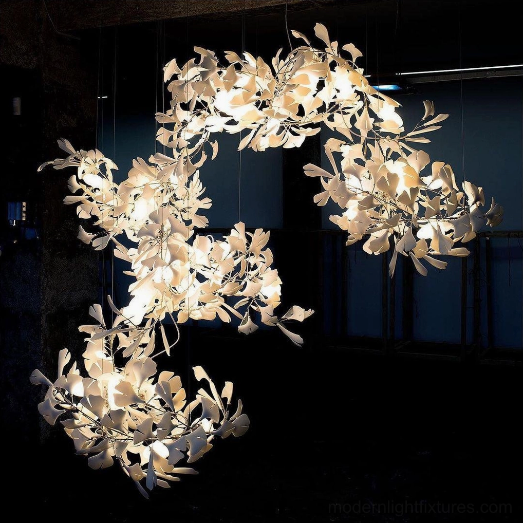 Detail view ginkgo ceramic pendant chandelier showing bulb socket and leaf mounting system