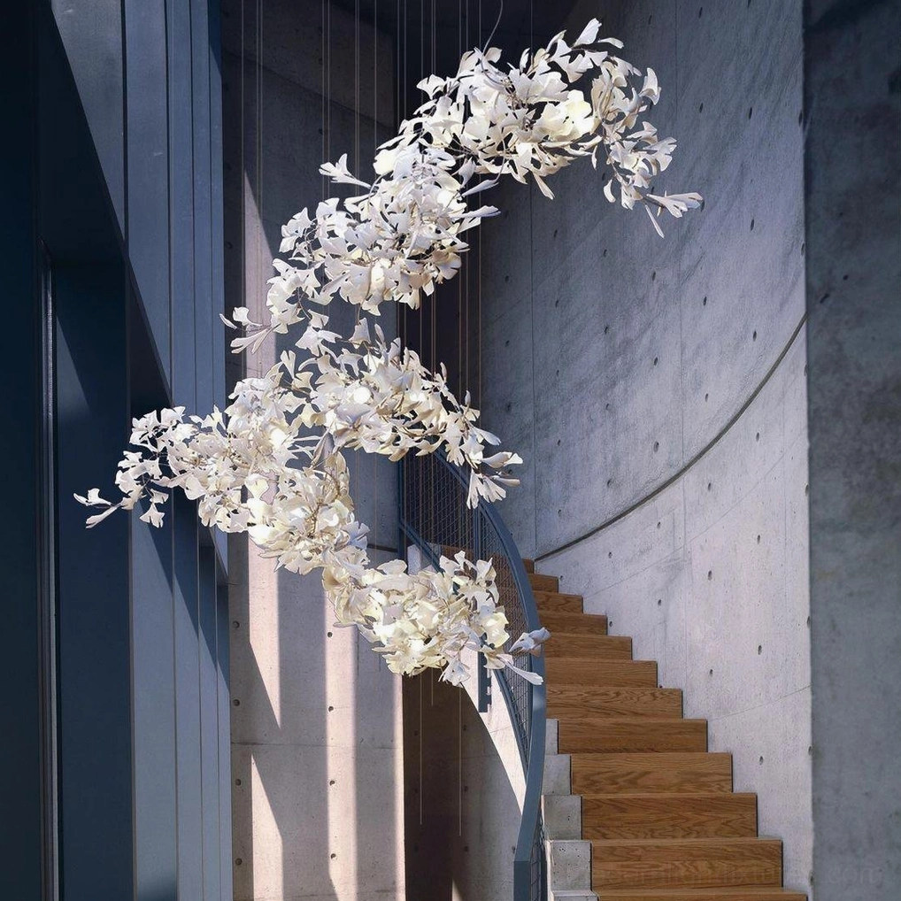 Ginkgo leaf chandelier in modern concrete stairwell showing natural organic shape and off-white finish