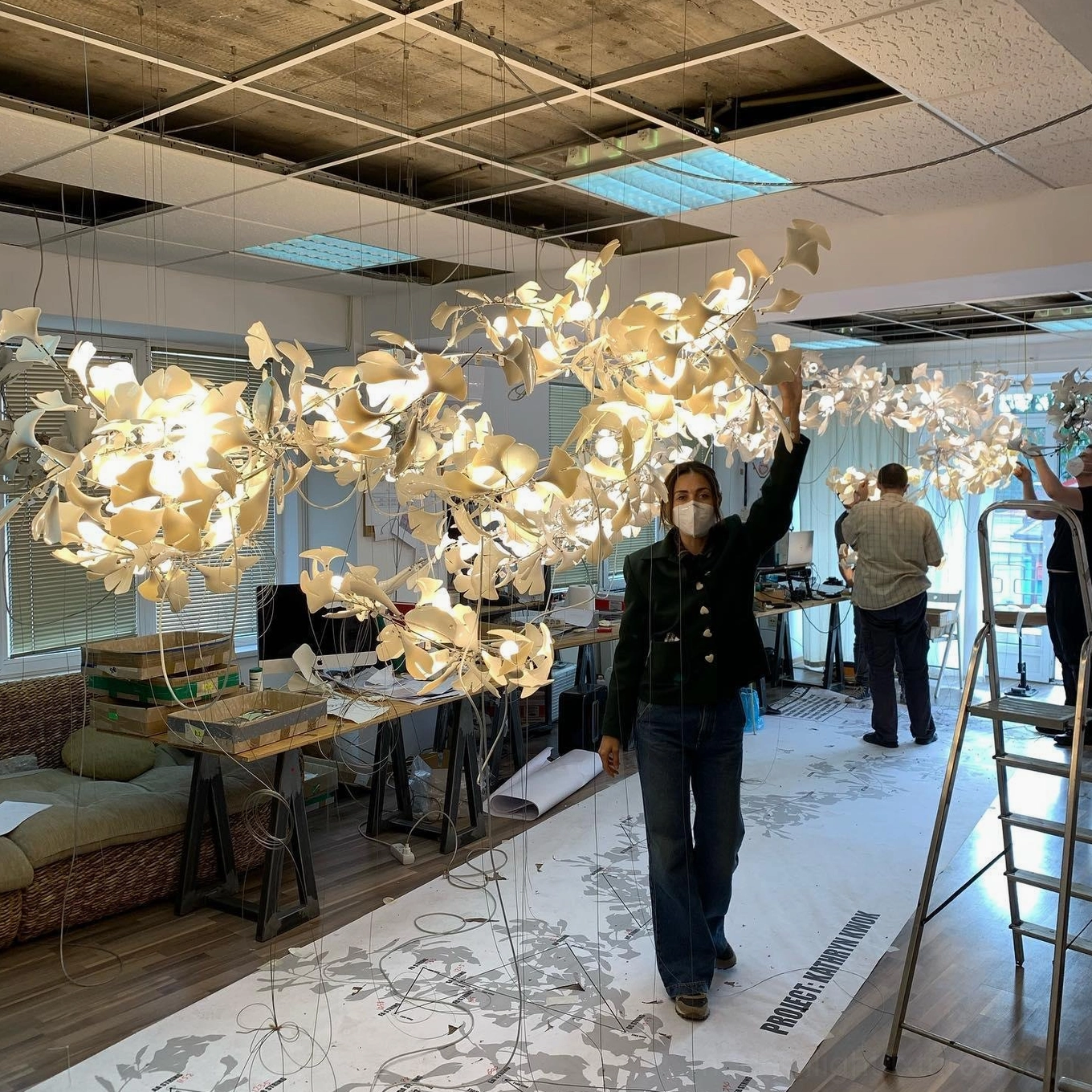 Ginkgo leaf pendant chandelier with cream ceramic finish and flexible metal framework ready for customization