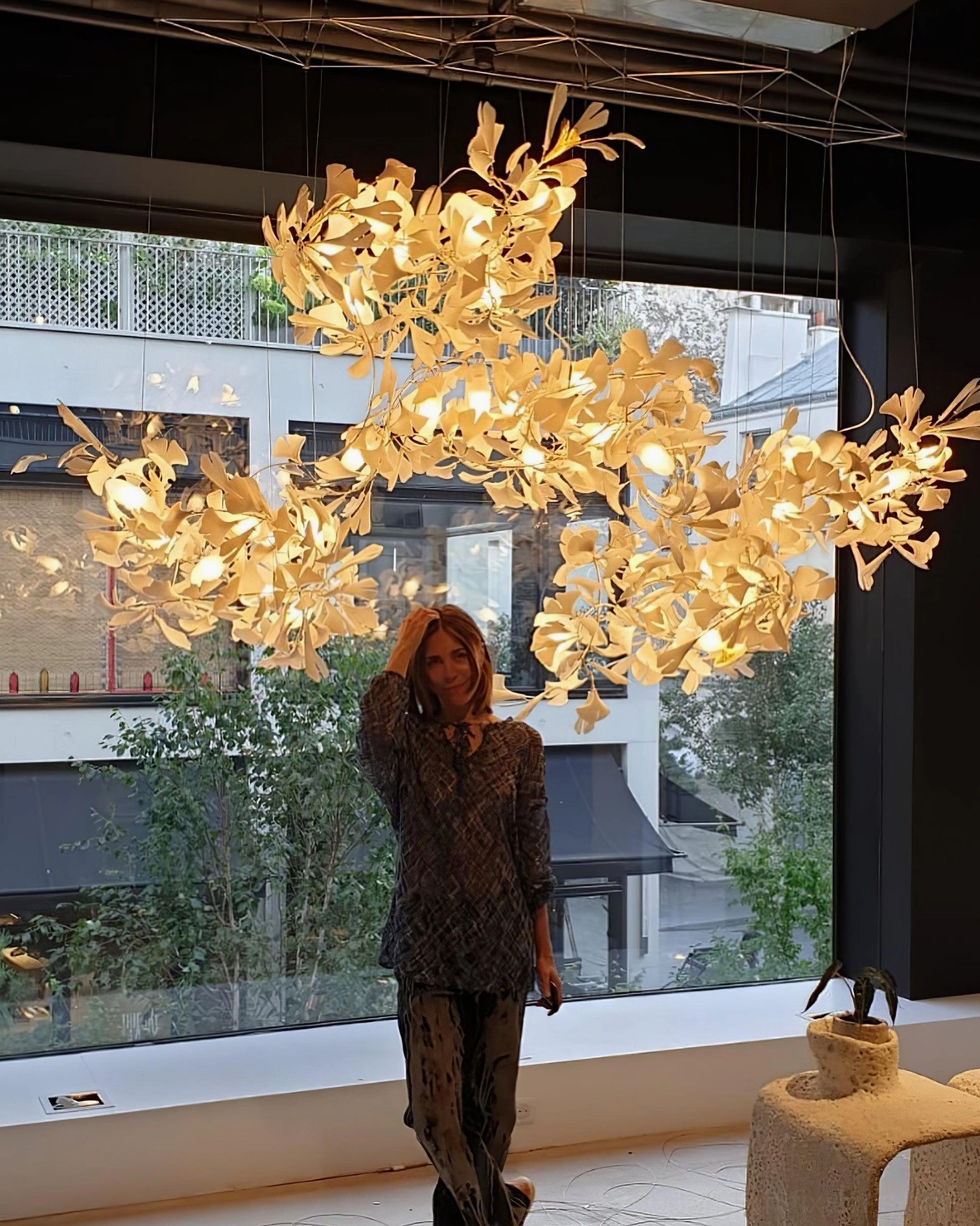 Ginkgo leaf chandelier with four integrated light modules creating cohesive sculptural whole
