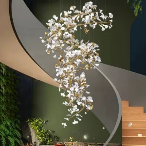 Modern ginkgo leaf crystal chandelier installed in luxury villa staircase with green accent wall and gold branch structure