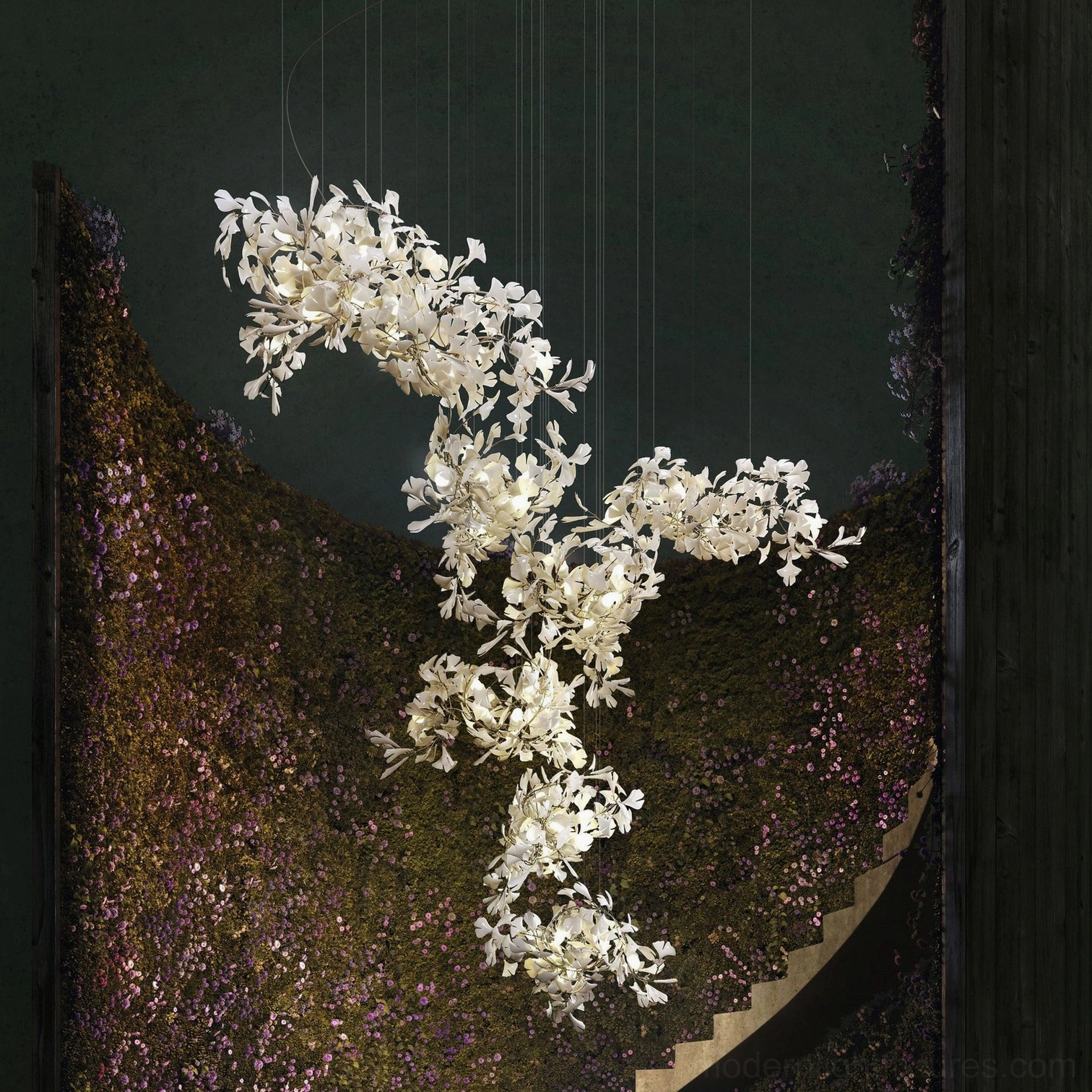Ginkgo chandelier with brushed gold finish body and white ceramic leaves in elegant setting