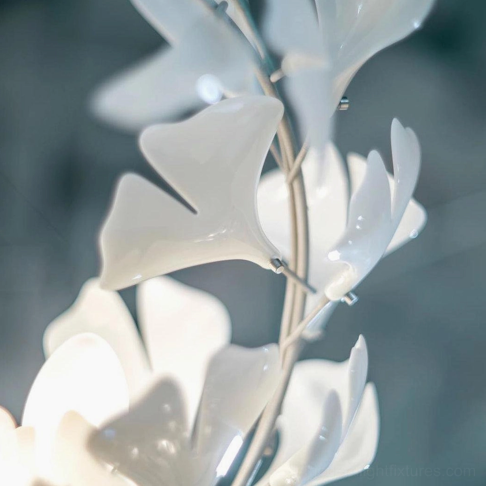 Ginkgo leaf pendant chandelier illuminated view showing warm light effect through ceramic