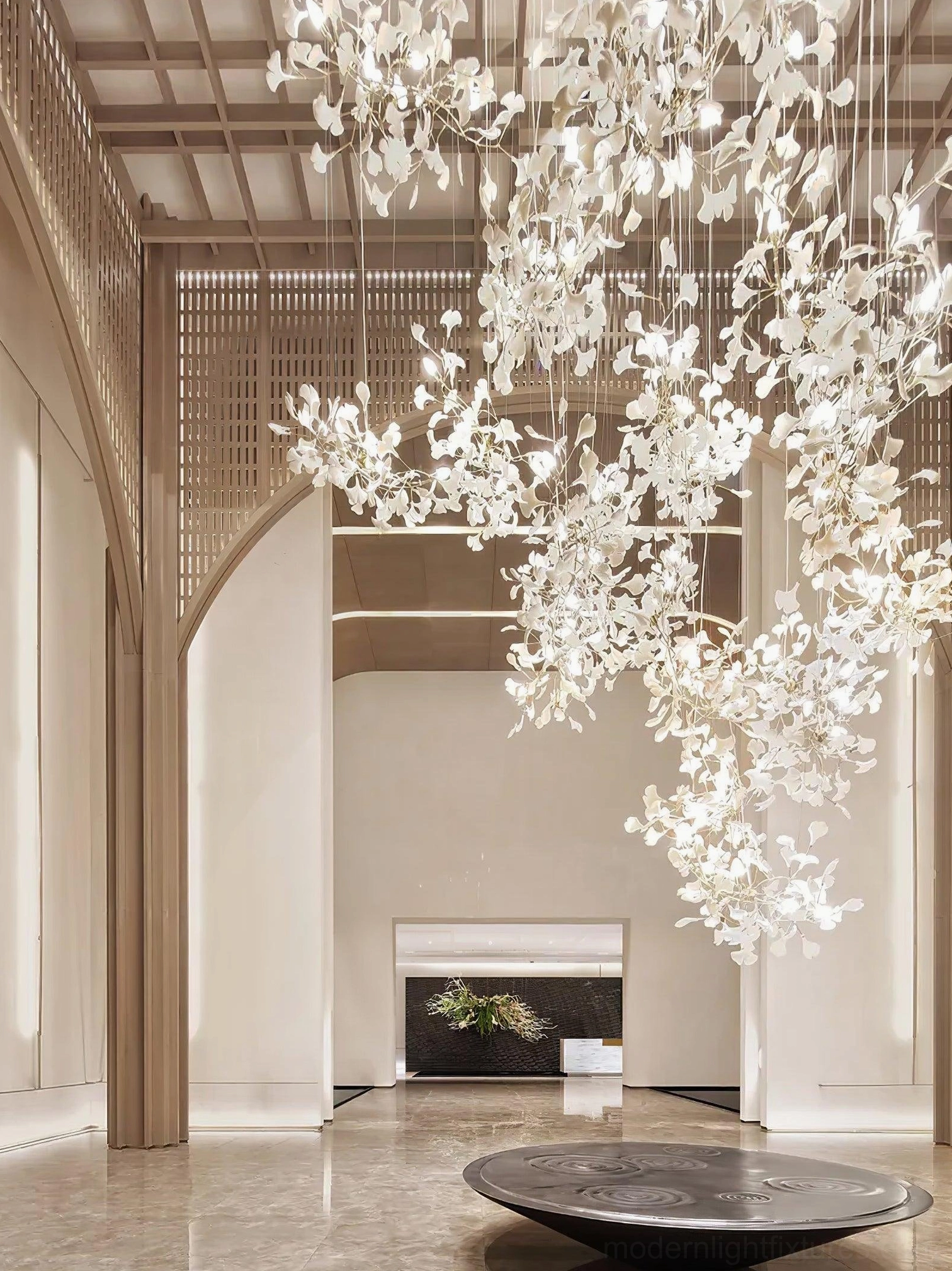 Ginkgo pendant chandelier detail showing leaf-to-branch connection and mounting system