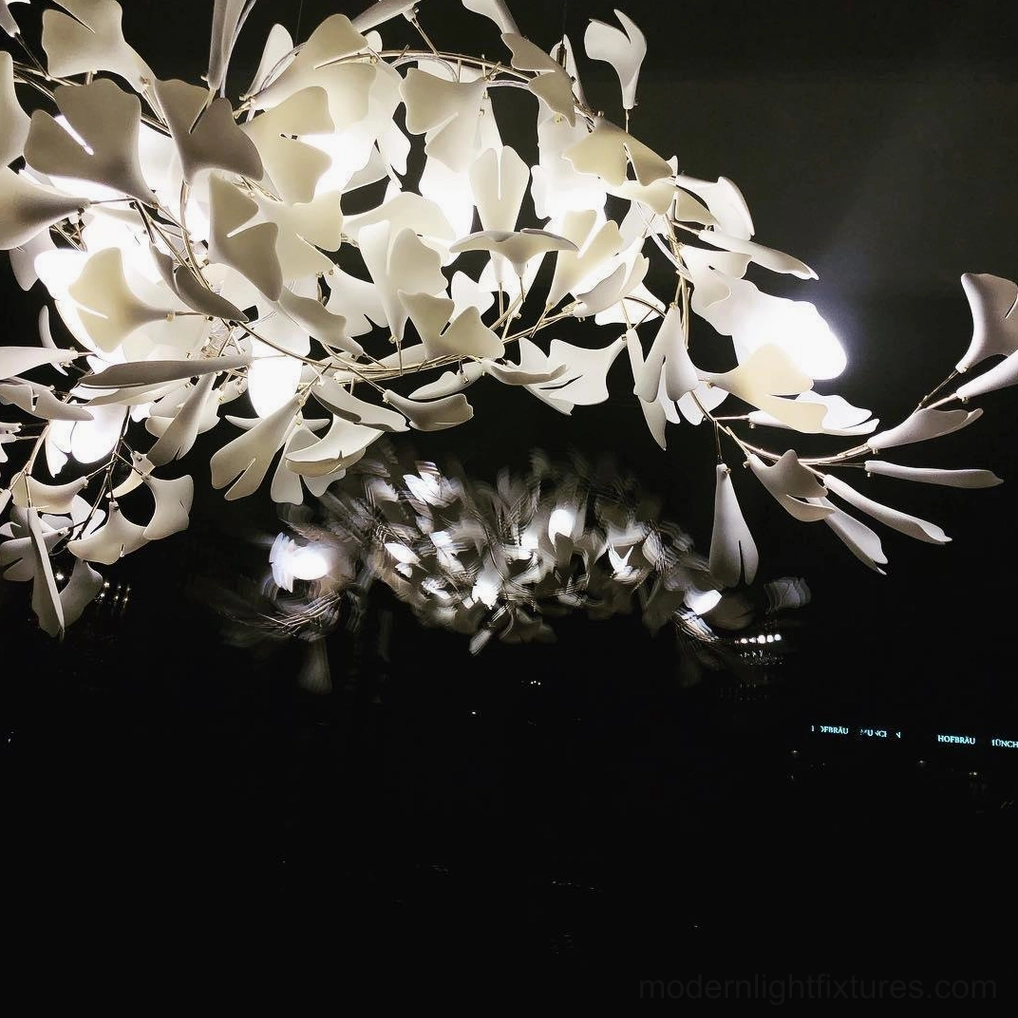 Ginkgo leaf chandelier detail view showing ceramic leaf mounting and metal branch construction