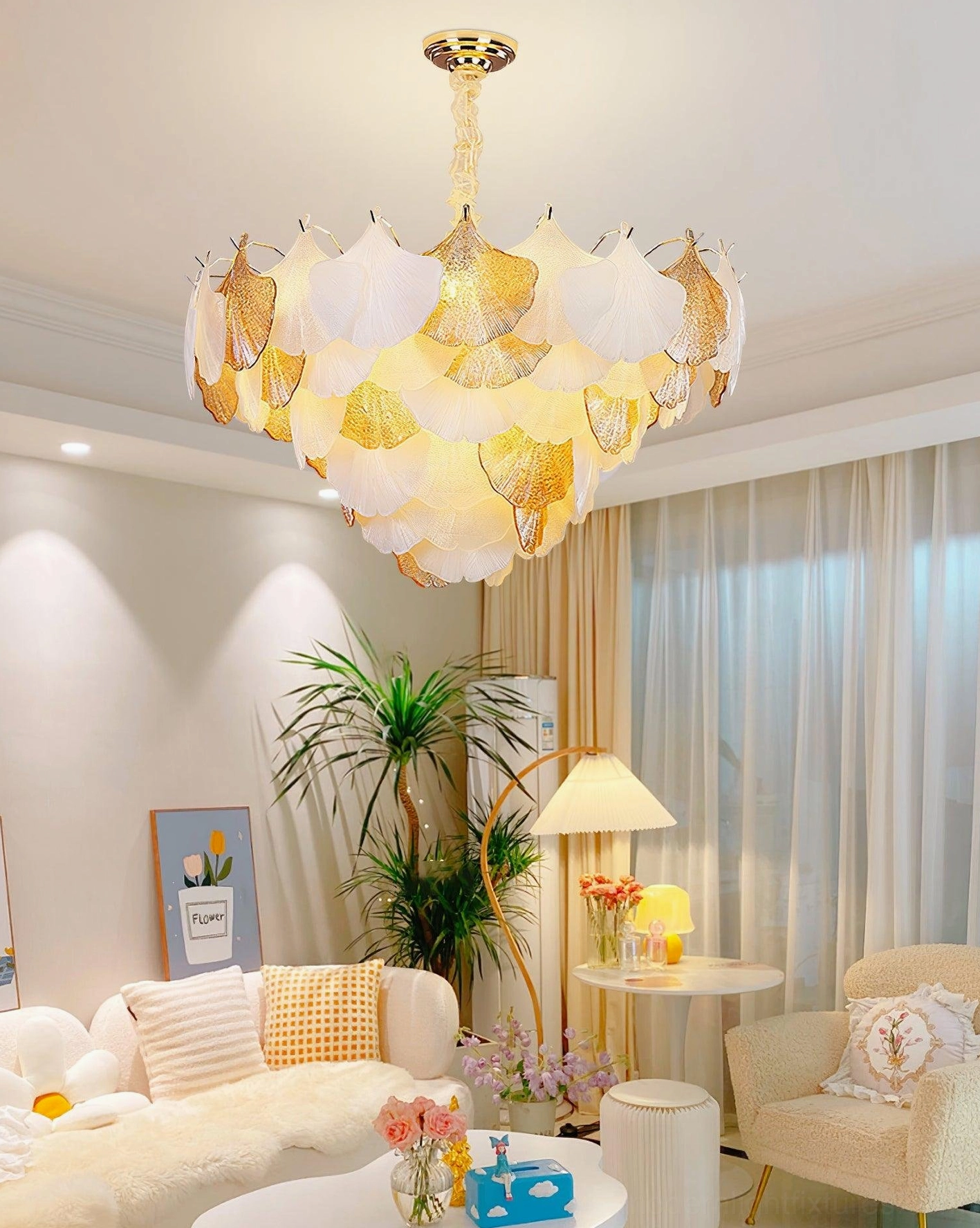 Ginkgo chandelier in bright modern living room with soft warm ambient lighting and home decor styling