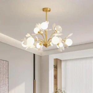 Ginkgo chandelier installed in modern minimalist living room, eye-level view with warm brass finish and glowing frosted shades